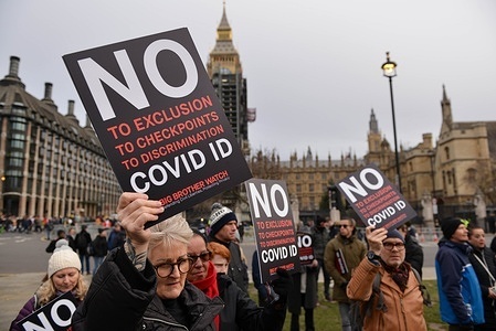 Demonstrators hold placards saying No Covid ID during the protest.
Rights and equality groups, and anti covid passes protesters, gathered at Parliament square to oppose the introduction of mandatory Covid ID's.