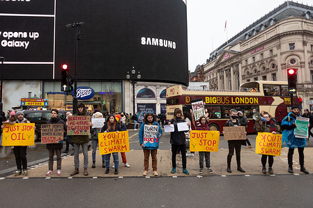 Protestors seen holding placards that say 'Just stop oil', 'Empty promises, endless growth, business as usual. Death sentence', 'Business as usual is killing us', 'Youth Climate Swarm', and 'Turn the tide on ecocide' during the demonstration.
Launched by the Youth Climate Strike, climate activists lined up in a main road at Piccadilly Circus with banners and loudspeakers. Youth Climate Strike is a group comprising of youngster enraged by the government's inaction in relation to climate change. They organise demonstrations with the aim of garnering the public's attention, including peaceful disruptions across the city.