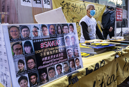 Pro-democracy activist Koo Sze-yiu (R) is seen next to a placard with pictures for numerous political activists currently in prison during a protest against the National Security Law (NSL) in Hong Kong.
Pro-democracy activist Koo Sze-yiu stages a protest in Hong Kong, against the National Security Law (NSL) and demanding the release of all the political prisoners in Hong Kong.