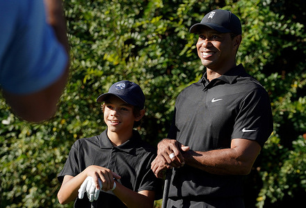 Tiger Woods and his son Charlie pose for photos, during the PNC Championship at the Ritz-Carlton Golf Club.
Tiger Woods is making his return to competitive golf, 10 months after sustaining serious leg injuries in a car crash. Woods is paired with his son, Charlie for the tournament.
