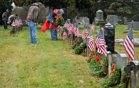 Volunteers lay wreaths on the graves of Veterans as part of Wreaths Across America.612 wreaths were placed at veterans graves by volunteers at the Hanover Green Cemetery. Their mission is to remember, honor and teach about veterans that served America.