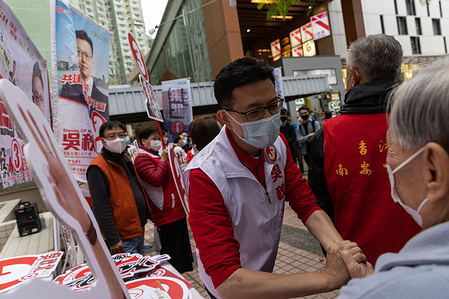 Pro-China candidate Stanley Ng Chau-pei shakes hand with a supporter during his rally in Siu Sai Wan.
The 2021 Legislative Council General Election has been held on December 19, with a 30.2 per cent turnout rate in the election, the lowest since 1997 as pro-China or pro-establishment candidates won a sweeping victory. This is the first major election for the legislative council since the electoral system reformation, a major crackdown on pro-democratic parties and the establishment of Hong Kong National Security Law, with the introduction of the Candidate Eligibility Review Committee to ensure that only patriotic candidates are allowed under the Beijing overhaul.