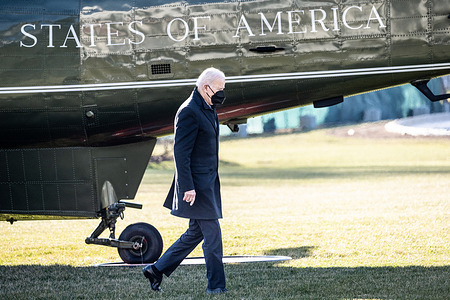 President Joe Biden walking towards the Oval Office after returning to the White House via Marine One.