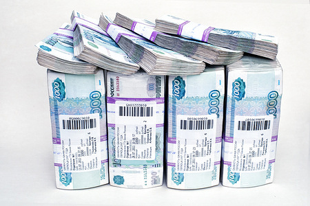 In this photo illustration bundles of banknotes with a nominal value of 1000 Russian rubles in a bank package. 
The photo shows 4,500,000 rubles, this is the approximate cost of an apartment in a provincial city.