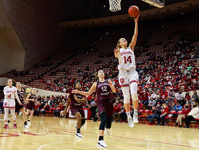 Indiana Hoosiers guard Ali Patberg (No.14) plays against Southern Illinois Salukis guard Makenzie Silvey (No.12) during the National Collegiate Athletic Association (NCAA) women's basketball game in Bloomington. 
Indiana University beat Southern Illinois 70-37.