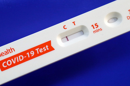 In this photo illustration, a covid-19 antigen home test kit shows a negative result.
United States President Joe Biden has announced his plan to mail 500 million Covid-19 rapid home test kits to American households. Also, Biden directs the insurance companies to reimburse individuals for private purchases.