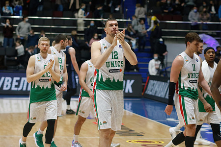 Artem Klimenko (No.12) of UNICS applauds during the VTB United League basketball match between Zenit and UNICS at Sibur Arena.Final score; Zenit 97:81 UNICS.