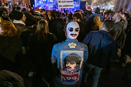 A protester wearing a jacket and mask with caricature of singer Freddie Mercuryon his back ,takes part during the demonstration.
With the slogan Plandemia, some 300 people have festively demonstrated in the center of Barcelona to show their rejection on the regulations and obligations derived from the Covid pandemic.