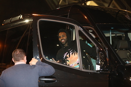 Jason Derulo is seen in a car saying hi to people after arriving at Krakow airport.