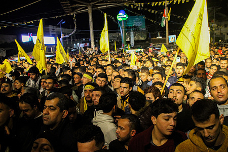 Palestinian Fatah supporters wave their yellow flags during a rally at the Palestine square in commemoration of the 57th anniversary of the Fatah movement.
The Fatah is formerly known as Palestinian National Liberation Movement.