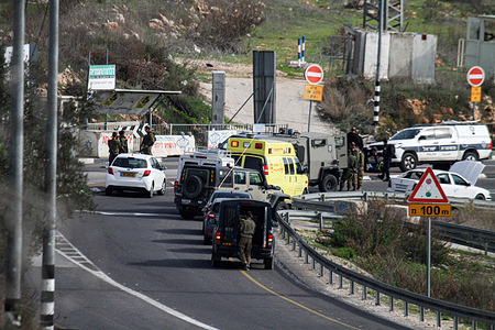 An Israeli ambulance transports the body of the Palestinian young man who tried to stab an Israeli soldier at the Haris village in the north of the occupied West Bank. The Israeli army said that a Palestinian young man tried to stab an Israeli soldier near a parking lot.