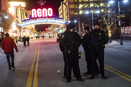 Police watch the streets on New Years.
People gather to watch fireworks and ring in the New Year.
