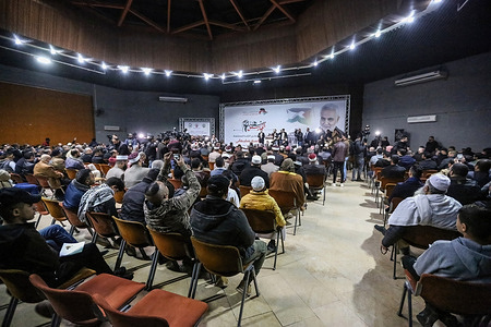 Palestinians attend a ceremony commemorating the second anniversary of the assassination of the Quds Force commander in the Iranian Revolutionary Guard, Qassem Soleimani, who was assassinated by Israel and the United States of America in Iraq two years ago. The event was held at the Rashad Al-Shawa Cultural Center, west of Gaza City.