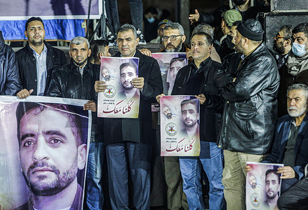 Palestinian Islamic Jihad demonstrators hold pictures ofHisham Abu Hawash, a Palestinian who was arrested by Israel.
The demonstrators initiated a protest after a 40-year-old Palestinian man named Hisham Abu Hawash put himself on a hunger strike for more than 140 days after he was arrested by Israel. He is currently placed into administrative detention by Israel.