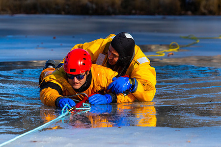 A rescuer helps a faux victim out of a frozen pond during the training.
The Reno Fire department took part in a water rescue training on ice at Idlewild Park. Each year the department works to save both people and animals trapped by frozen water bodies.