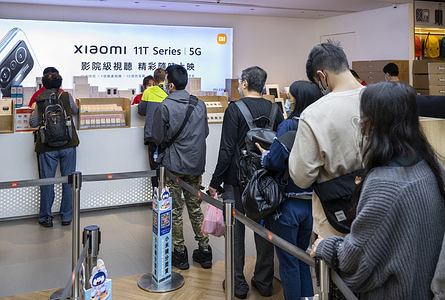 Clients purchasing Chinese multinational technology company Xiaomi products at its flagship store in Hong Kong.