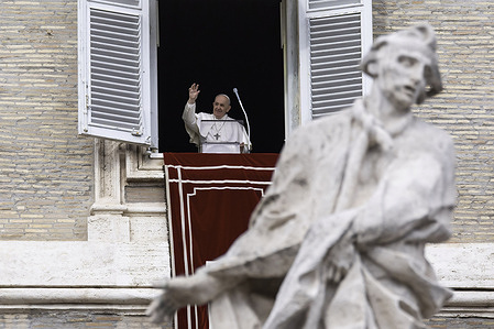 Pope Francis waves to the faithful during the Angelus prayer.Pope Francis delivers the Angelus prayer for the Epiphany of the Lord from the window of the Apostolic Palace overlooking St. Peter's Square in Vatican City.