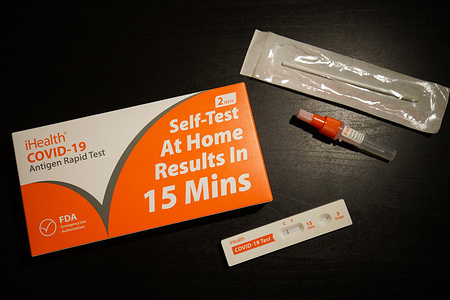 In this photo illustration, a Covid-19 self-test package is seen displayed on a table.
As "Omicron", a Covid-19 variant affects the world and the surge of cases, people in Califonia demand to have self-test packages for sale to be able to self-test for the virus. The Self-test package is designed and sold by iHealth Labs, a company in California, and made in China.