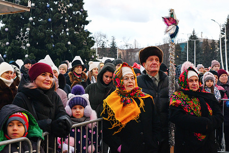 People are seen during the celebration of the Orthodox Christmas in the center of Kramatorsk.Christmas in Ukraine can be celebrated on the 25th of December or 7th of January. This is because different Orthodox and Greek Catholic churches within Ukraine use the old 'Julian' or the 'new' Gregorian calendars for their church festivals.