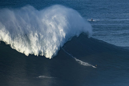 A surfer seen riding a big wave at Praia do Norte Beach in Nazare.
First big swell of 2022 reached Nazare and many big wave surfers were in the water to enjoy the big waves in the north Atlantic.