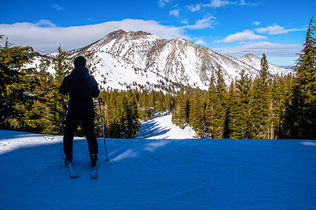 A skier pauses by a snow pack testing area. 
The Natural Resources Conservation Service invited the media to attend a snowpack test at one of their regional sites. They said that the snowpack has recorded 185% of the normal average but experts remain concerned about a possible dry forecast for the area.
