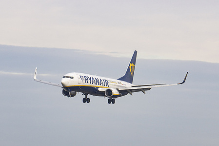 A Boeing 737-800 aircraft of the Irish low cost carrier Ryanair is flying and landing at Eindhoven airport in the Netherlands. The budget airline airplane is under the registration SP-RKK.