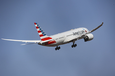 American Airlines Boeing 787 Dreamliner takes off from Athens International airport, flying to the USA on a sunny day.
