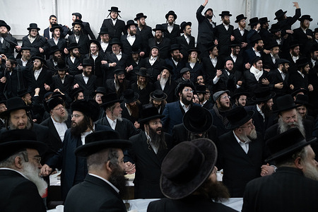 Ultra orthodox Jews (hassids) are seen dancing in a hall.
Every year ultra orthodox Jews come to Lelov (Poland) to visit the grave of tzadik David Biderman to pray, dance and sing during his death anniversary. This is the traditional ceremony of Hassid Jews.
