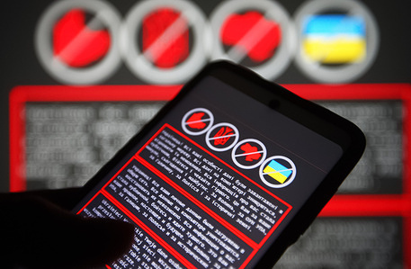 In this photo illustration, a warning message in Ukrainian, Russian and Polish languages is displayed on a smartphone screen and in the background.
Hackers carried out attacks on several Ukraine's government websites, including the Ministry of Foreign Affairs, the Ministry of Education and Science, the State Service for Emergency Situation and others, reportedly by local media. This attack, on Ukrainian government web resources is the largest in the last four years.