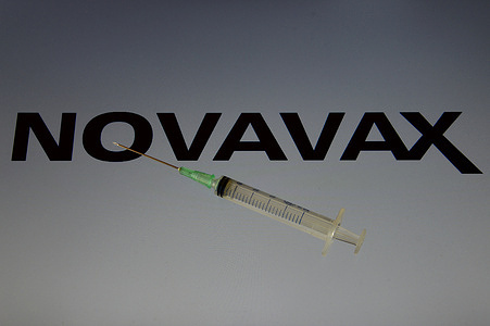 In this photo illustration, a syringe is seen placed on a Novavax logo.
The vaccine against Covid-19 from the American laboratory Novavax becomes the fifth to be available in France after the authorization of the High Authority of Health (HAS).
