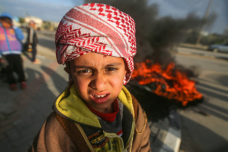 A boy is seen looking on, during the demonstration.
Palestinians seen protesting in Rafah, in the southern Gaza Strip against Israel's confiscation of Palestinian lands and its actions in the Negev desert in southern Palestine.