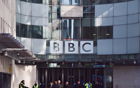 The BBC logo is seen at the entrance at Broadcasting House, the BBC headquarters in central London.
The UK government has announced it will freeze the broadcaster's budget for the next two years and will end the license fee in 2027.