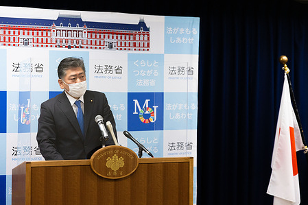 Japanese Minister of Justice, Yoshihisa Furukawa answers questions from reporters during his regular press conference in Tokyo.