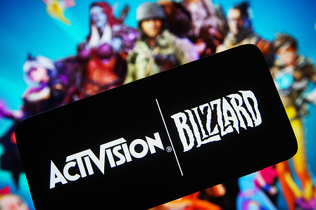 In this photo illustration, the logo of Activision Blizzard, a video game company is seen displayed on a smartphone screen.
