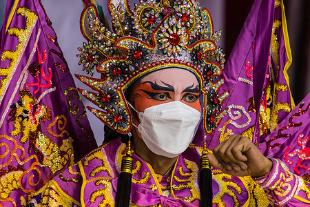 A traditional Chinese opera peformer is seen wearing a face mask during an event before Chinese New Year celebrations in the Lhong 1919.
Located on the banks of the Chaophraya river in Bangkok, Lhong 1919 is a 19th-century Chinese mansion that has been restored. It has become a popular tourist attraction, featuring restaurants, stores and a shrine.