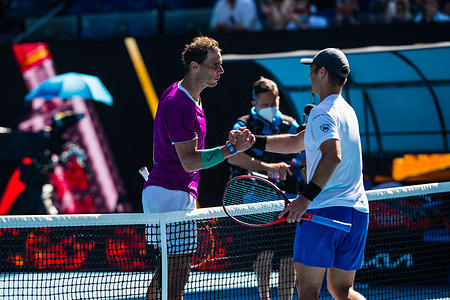 World No.5 Rafael Nadal (L), and World No.66 Marcus Giron (R) shake hands after the Australian Open 2022 Round 1 match of the Grand Slam at Rod Laver Arena in Melbourne Olympic Park.
(Final score Nadal wins in 3 sets 6:1, 6:4, 6:2).