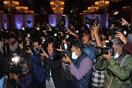 Bangladesh photographers are seen working during the Export market program at Pan Pacific Sonargaon Hotel in Dhaka.