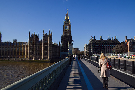 General view of the Houses of Parliament, Big Ben, and Westminster Bridge on a clear day.