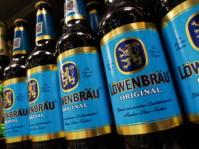Lowenbrau brand beer on a supermarket shelf.